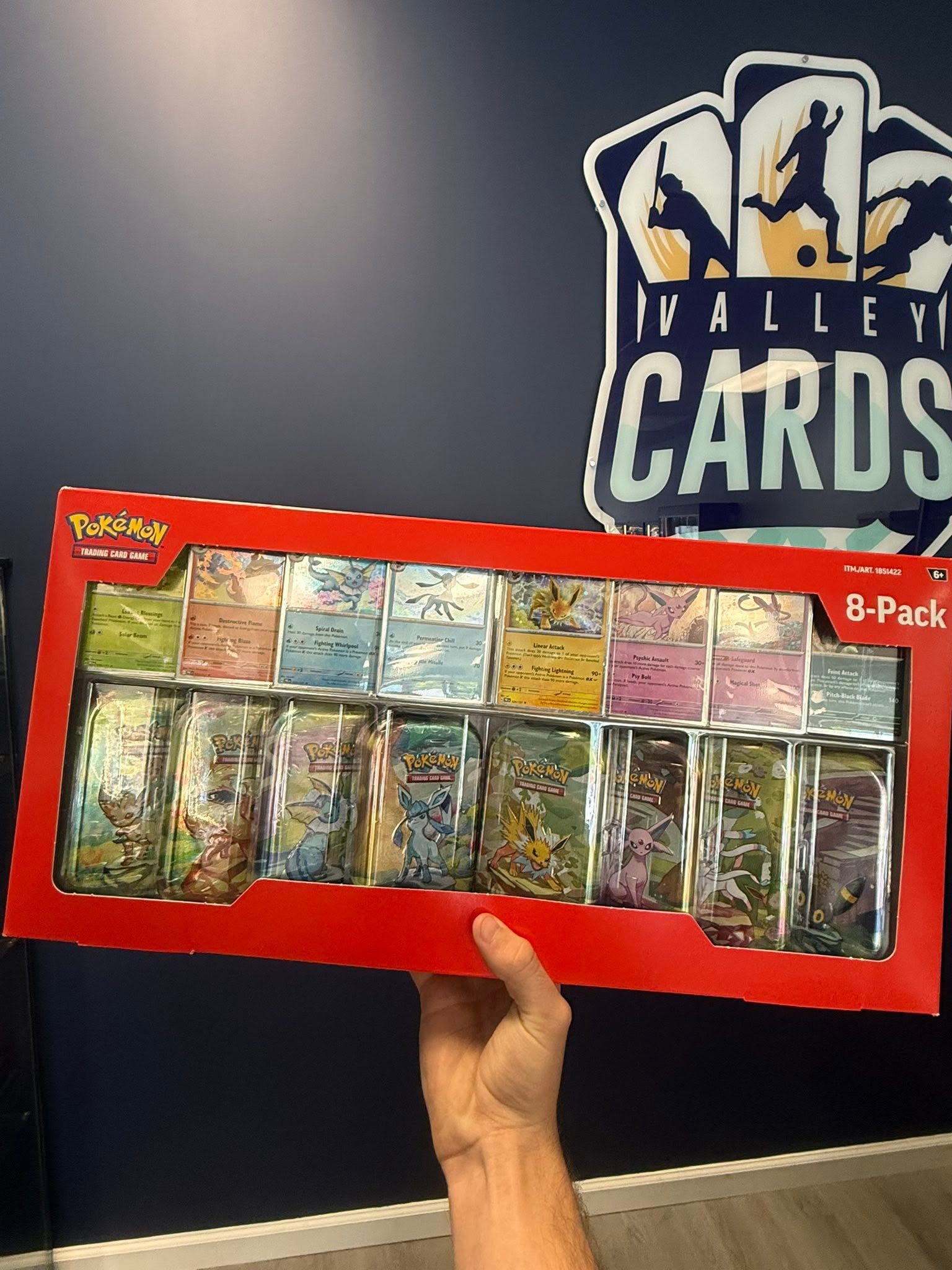 Sealed Pokemon trading card tins photographed by Valley Cards